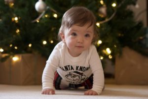 Charlotte Thiessen crawling by Christmas tree after being born prematurely