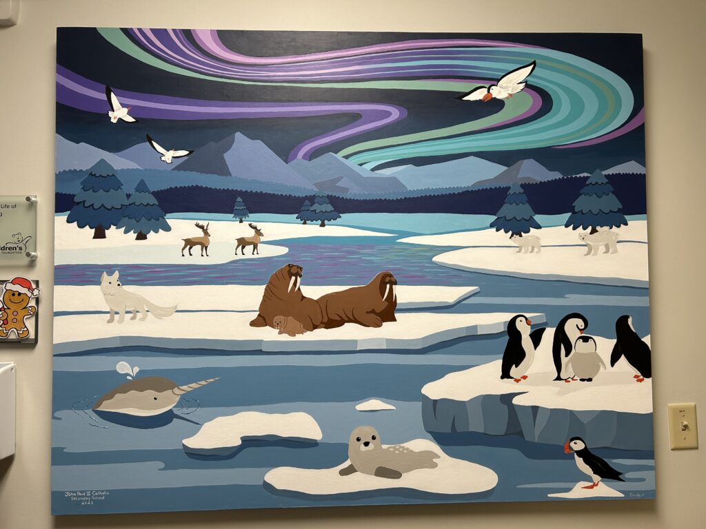 A wall mural featuring an arctic scene painted by high school students.