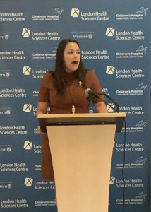 Dr. Alexandra Zorzi speaks at a lectern.