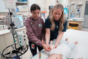 Children’s Hospital, LHSC Registered Nurses Milena Ponte (L) and Karissa Clements (R) with one of the simulation dolls that will be used in hands-on training for frontline health care professionals in communities across Southwestern Ontario thanks to a gift from the RBC Foundation